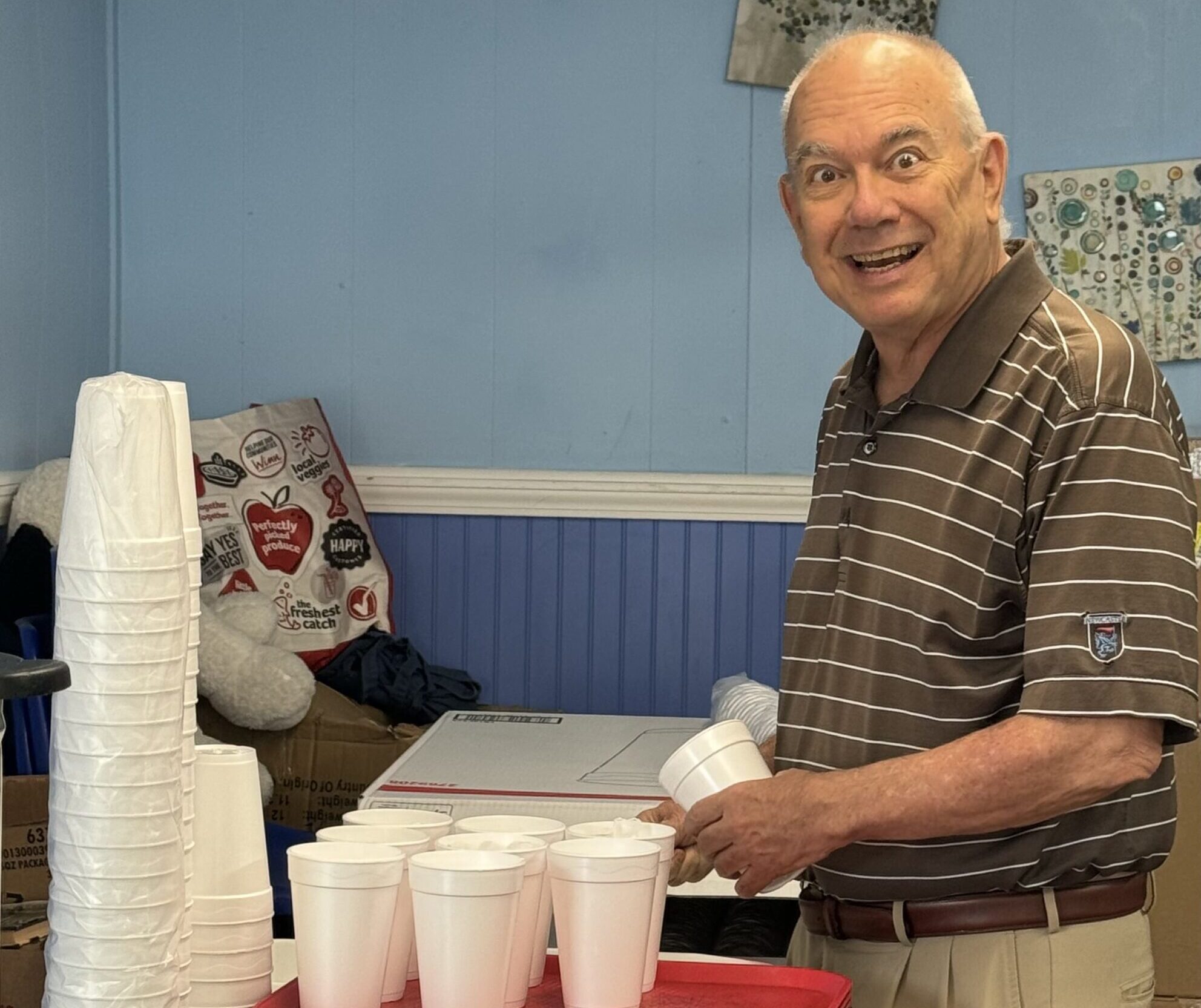 Rotarians volunteer at Manna House and tour Tiny Homes